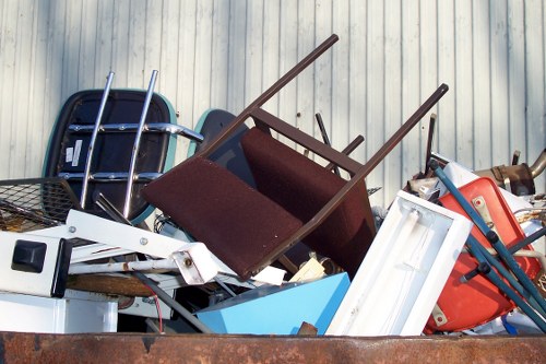Workers disposing of construction waste in Earls Court